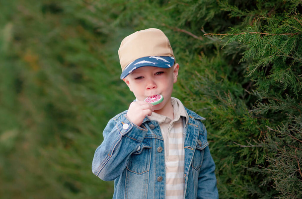 Liitle Boy with sweet tasty candy - 写真・画像