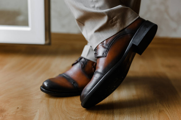 Elegant and hipster grooms shoes with cool socks. Wedding photography concept. Selective focus.j. High quality photo - Fotó, kép