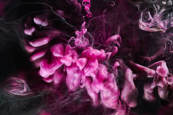 Dark Pink and black abstract ocean background. Splashes, drops and waves of paint under water, clouds of smoke in motion - Fotoğraf, Görsel