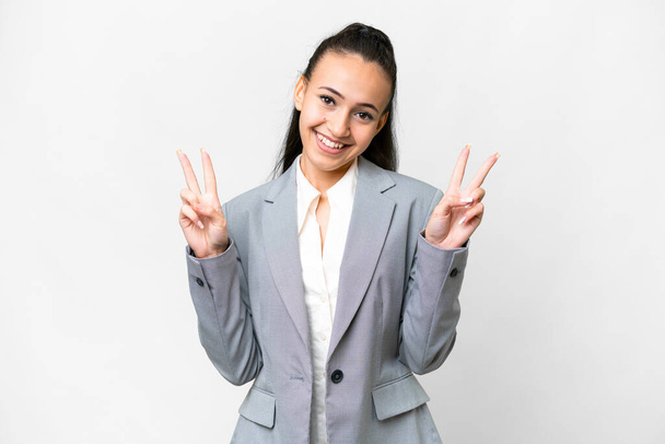 Young Arabian woman over isolated white background showing victory sign with both hands - Φωτογραφία, εικόνα