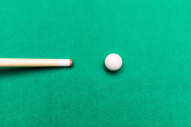Billiard pool game one white ball with cue on billiard table with green cloth.Copy space. - Photo, Image