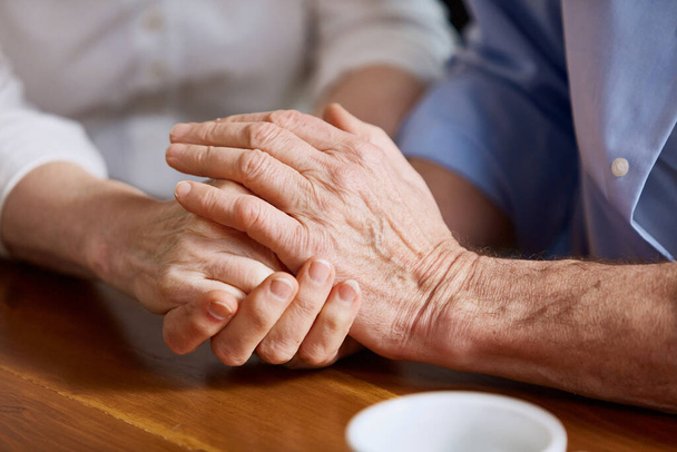 Close-up images of human hands, senior, old couple, man and woman holding hands, giving love and support. Concept of family, relationship, retirement, lifestyle, happiness - Foto, imagen