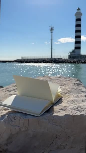 Wind Flipping Notebook Pages on Sea background - Footage, Video