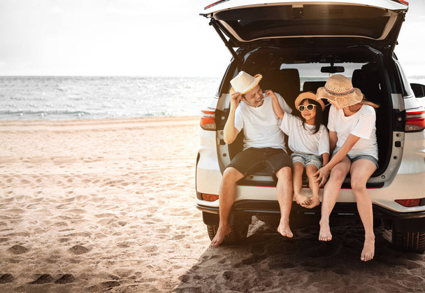 Family with Car travel driving road trip summer vacation in car in the sunset, Dad, mom and daughter happy traveling enjoy holidays and relaxation together get the atmosphere and go to destination  - Photo, Image