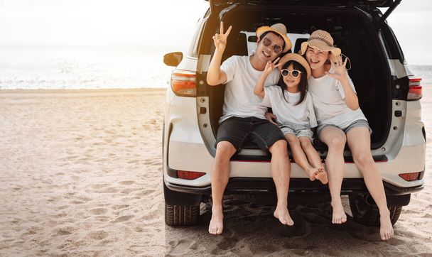 Family with Car travel driving road trip summer vacation in car in the sunset, Dad, mom and daughter happy traveling enjoy holidays and relaxation together get the atmosphere and go to destination  - Foto, immagini