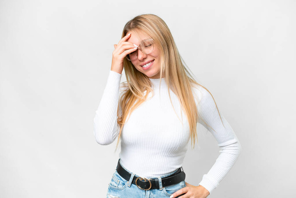 Young pretty blonde woman over isolated white background laughing - Fotografie, Obrázek