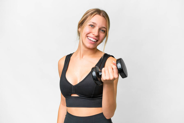 Blonde sport woman making weightlifting over isolated white background with happy expression - Foto, imagen