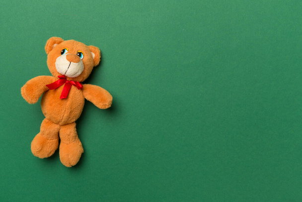 Cute teddy bear on color background, top view - Fotoğraf, Görsel