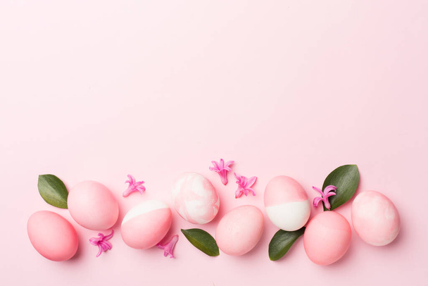 Pink Easter eggs on color background, top view - Photo, Image