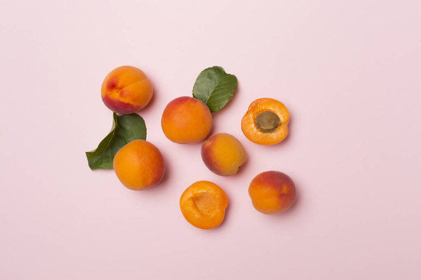 Flat lay with ripe ap.ricots on color background, top view. - Φωτογραφία, εικόνα