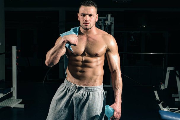 Sport health. Stay hydrated concept. Weightlifter gym man preparing for training. Muscular athletic body - Φωτογραφία, εικόνα