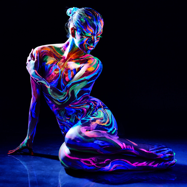 Charming nude girl with luminescent body art - Фото, зображення