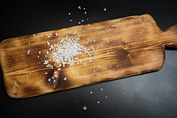 Sea salt on wooden board - Photo, Image