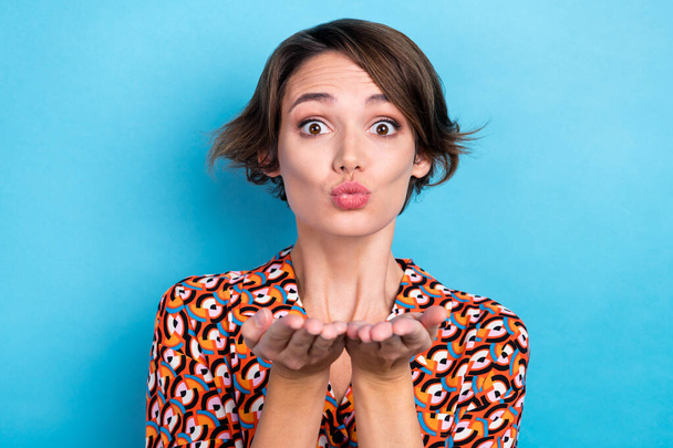 Photo of funny flirty woman wear print blouse sending two arms kiss isolated blue color background. - Fotografie, Obrázek