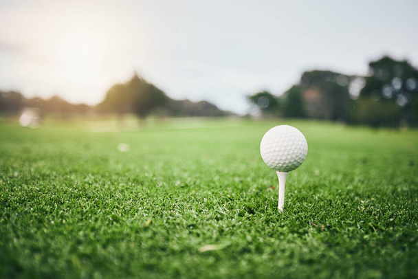 Sports, golf ball and tee on lawn in club for competition match, tournament and training. Target, challenge and games with equipment on grass field for leisure, recreation hobby and practice. - Foto, imagen