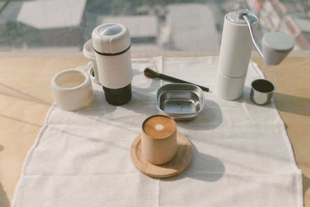 Close up of pressed espresso coffee on the table by the window. - Zdjęcie, obraz