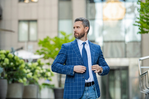 photo of charismatic business boss with tie. business boss outdoor. business boss on urban background. business boss wearing jacket in the street. - Фото, зображення