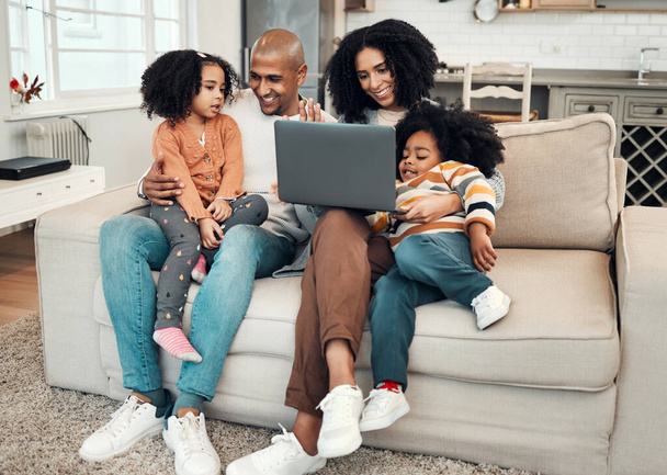 Happy, relax and family with a laptop for a movie, comedy show or subscription service. Smile, together and parents with children on the sofa for a film, series or entertainment on a computer. - Foto, imagen