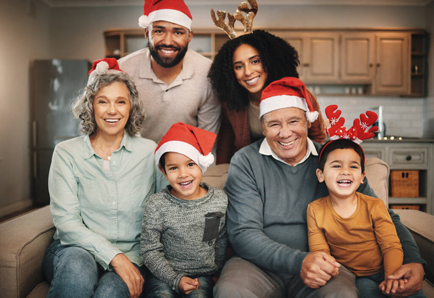 Christmas, big family and portrait smile on sofa in living room in home, bonding and care. Xmas, laughing and happy grandmother, grandfather and parents with boys or children enjoying holiday time - Фото, изображение