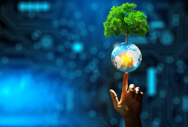 Mano puntando albero crescente su sfera di cristallo con convergenza tecnologica sfondo blu. Tecnologia innovativa, interazione con la tecnologia della natura, ecocompatibile, etica IT e concetto di ecosistema. - Foto, immagini