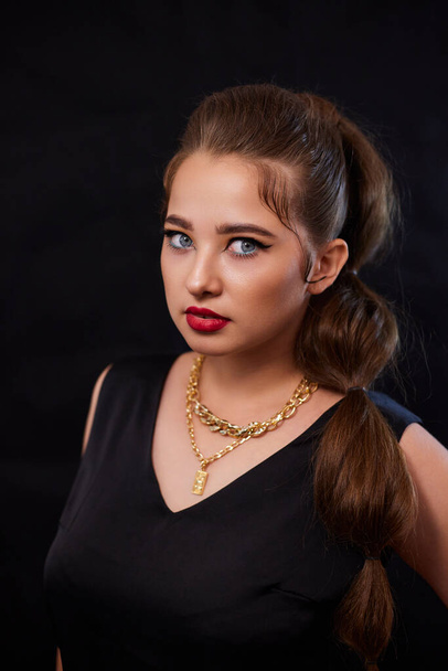 portrait shot of a young Ukrainian woman on the background, after make-up and hairstyle, for clothing advertising. - Fotoğraf, Görsel
