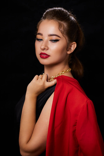 portrait shot of a young Ukrainian woman on the background, after make-up and hairstyle, for clothing advertising. - Photo, Image