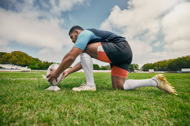 Rugby kick, sports man or ball in training game, practice workout or match on stadium field outdoors. Fitness, ready or athlete player in action playing in cardio exercise on grass in France, Paris. - Fotó, kép