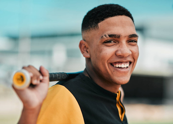 Hes always ready to spring into action. a young baseball player holding a baseball bat while posing outside on the pitch - Fotoğraf, Görsel