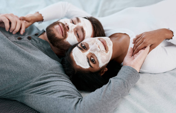 At home facials for when you need your spa fix. a young couple getting homemade facials together at home - Fotografie, Obrázek