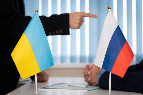 negotiations in diplomacy or business. Communication between representatives of the countries of Ukraine and Russia. negotiations of diplomats, conclusion of the pact concept. peace talks. - Фото, зображення