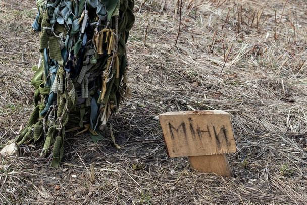 Warning sign with the inscription "mines" in Ukrainian. Ukraine, 2023. - Photo, Image