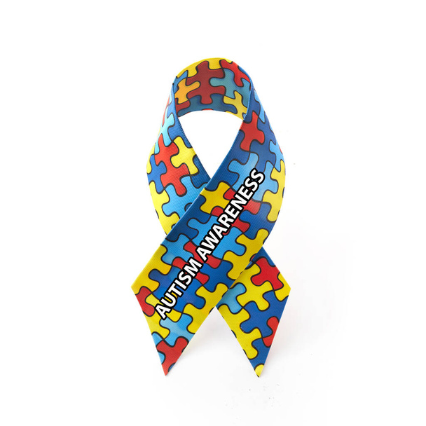World Autism awareness and pride day or month with Puzzle pattern ribbon on white background. - Foto, afbeelding