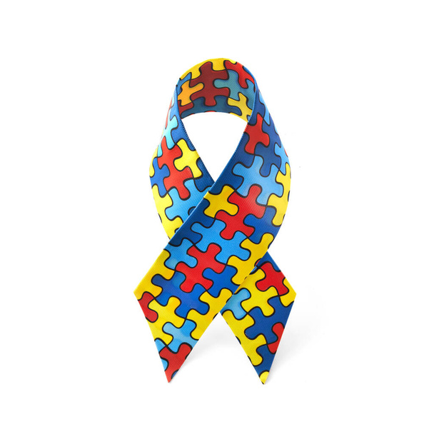 World Autism awareness and pride day or month with Puzzle pattern ribbon on white background. - Фото, зображення