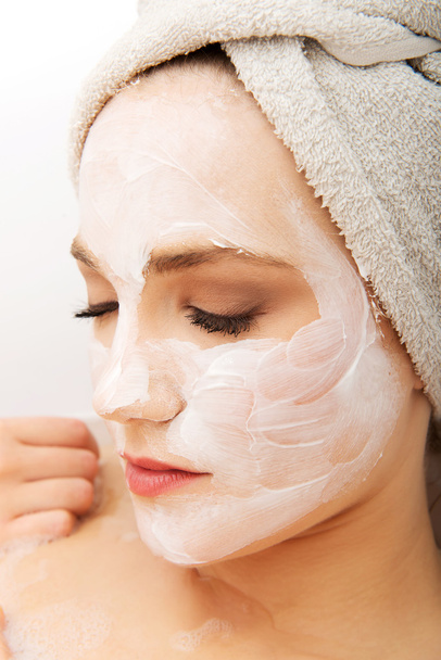 Woman relaxing with face mask. - 写真・画像