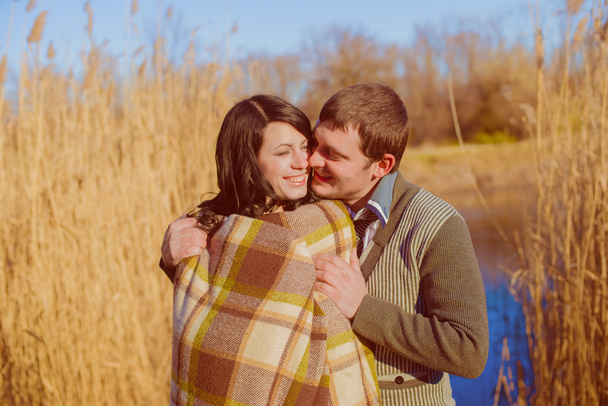 Couple in love near the river in the spring - Foto, Imagen