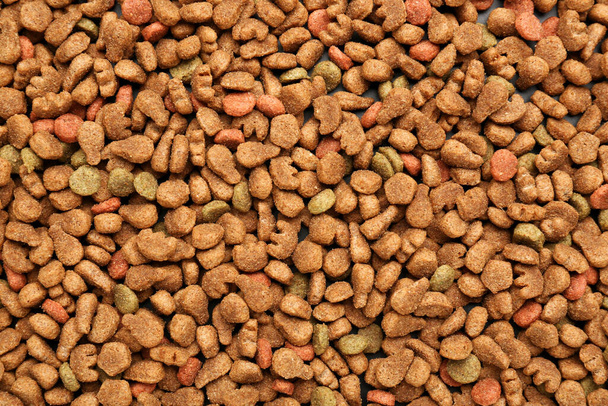 Сухой корм для домашних животных в качестве фона, крупный план - Фото, изображение
