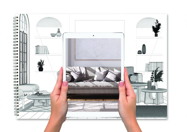 Kädet tilalla tabletti osoittaa olohuone boho tyyliin, yhteensä tyhjä projektin tausta, laajennettu todellisuus käsite, sovellus simuloida huonekaluja ja sisustustuotteita - Valokuva, kuva