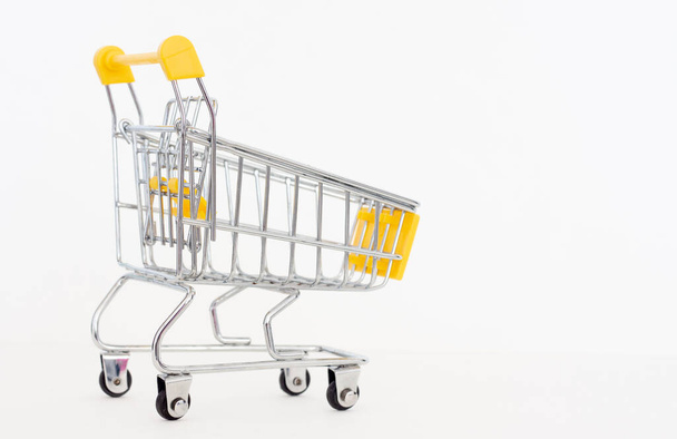 Toy shopping cart isolated on white background. - Foto, Bild