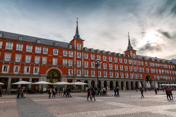 Madrid, Spain - FEB 16, 2022: Urban view from the Plaza Mayor, Town Square, a major public space in the heart of Madrid, the capital of Spain. - Φωτογραφία, εικόνα