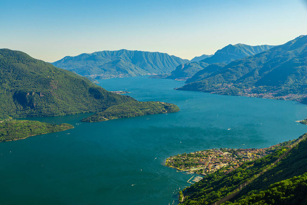 Panorama on the upper lake of Como, with the villages of Gera Lario, Domaso, and the mountains that overlook them. - 写真・画像