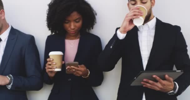 Diverse business team waiting and reading phones on social media. Group of corporate lawyers addicted to technology devices. Office professionals obsessed with facebook and twitter at lunch. - Imágenes, Vídeo