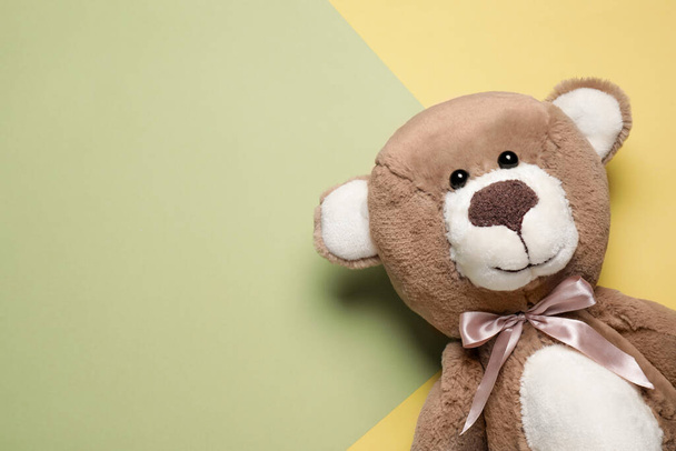 Cute teddy bear on color background, top view. Space for text - Фото, зображення