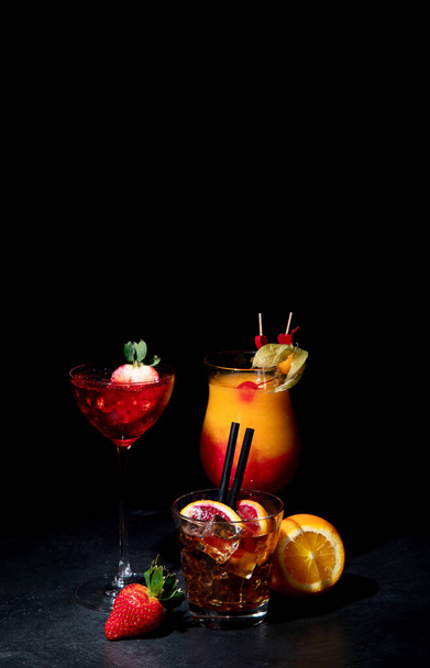 Set of various colorful cocktails on black background. Classic long drink cocktails menu concept. Copy, space - Φωτογραφία, εικόνα