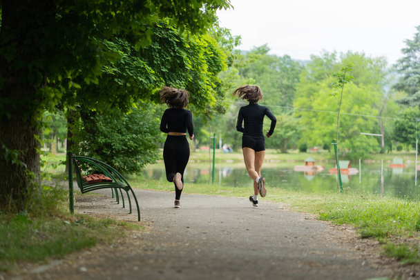 Attractive girls are running togetherearly in the morning - Fotoğraf, Görsel
