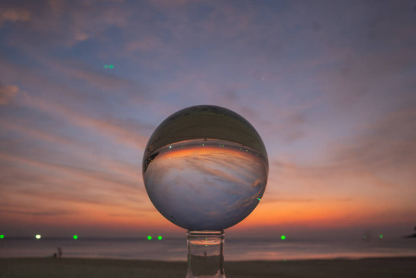 view of colorful nature at sunset inside crystal ball - Photo, Image
