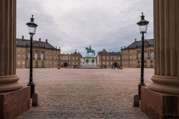 Amalienborg Square with the equestrian statue of the King Frederick V of Denmark, city center of Copenhagen - Photo, Image