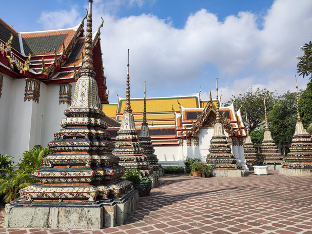 Beautiful chedi in the Wat Pho, Bangkok. It is one of the oldest and largest temples in Bangkok features the famous Reclining Buddha - Fotoğraf, Görsel