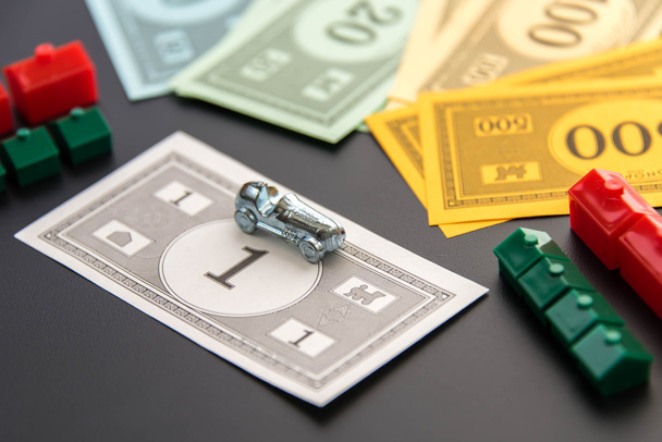 February 8, 2015: Houston, TX, USA.  Monopoly car, money, hotels - Fotografie, Obrázek