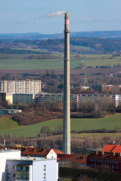 Tall industrial smokestack pipe in a city, Germany - Photo, Image