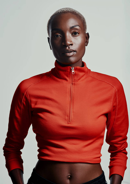 Athleisure is my kinda style. Studio shot of an attractive young woman in sportswear against a grey background - Foto, imagen